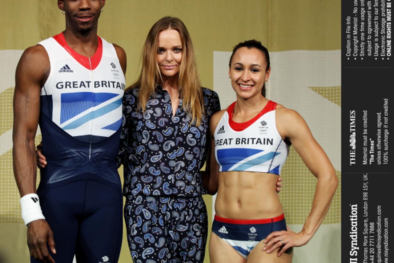 'The launch of the British team kit for the 2012 Olympics at the Tower of London. Jessica Ennis and Phillips Idowu pose for pictures with designer Stella McCartney. Credit: The Times Online rights mus