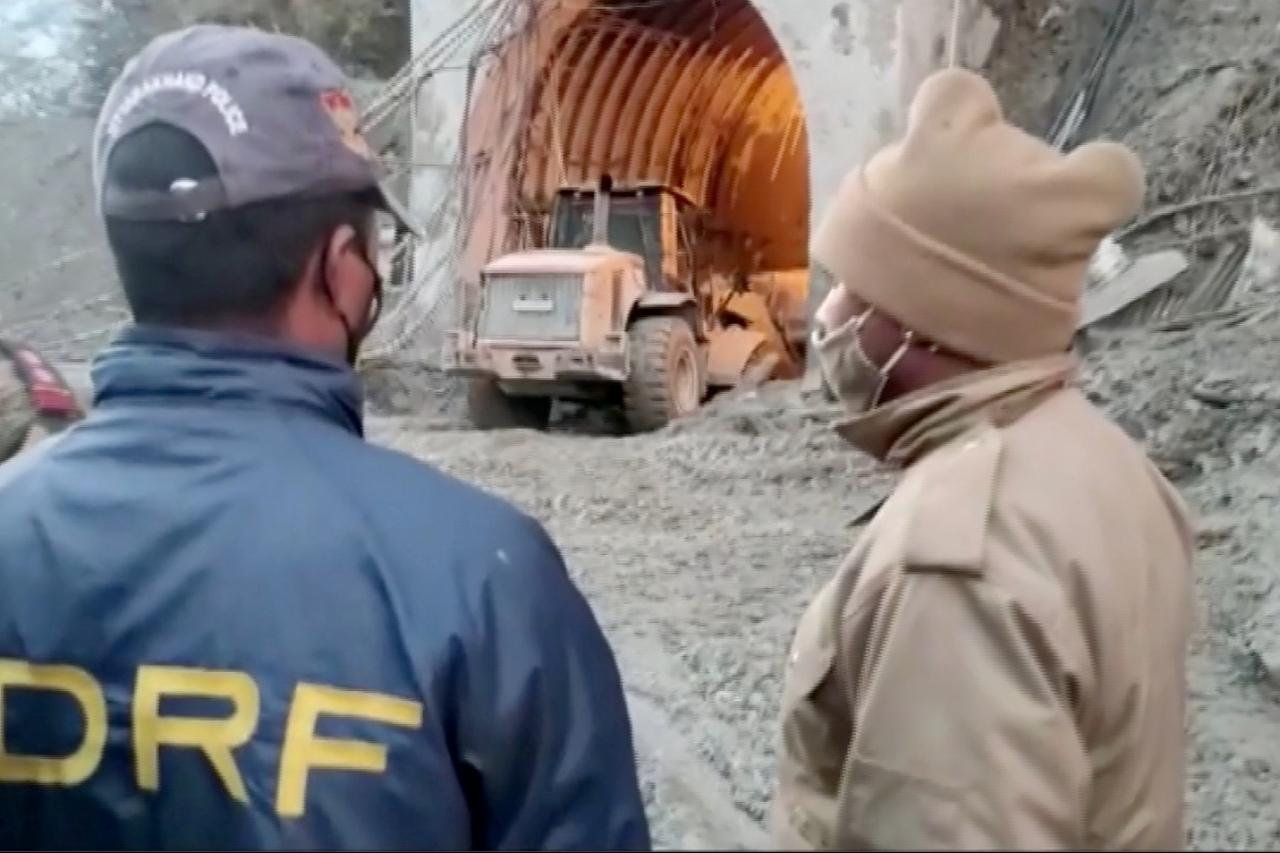 Members of Indo-Tibetan Border Police tend to people rescued after a Himalayan glacier broke and swept away a small hydroelectric dam, in Chormi