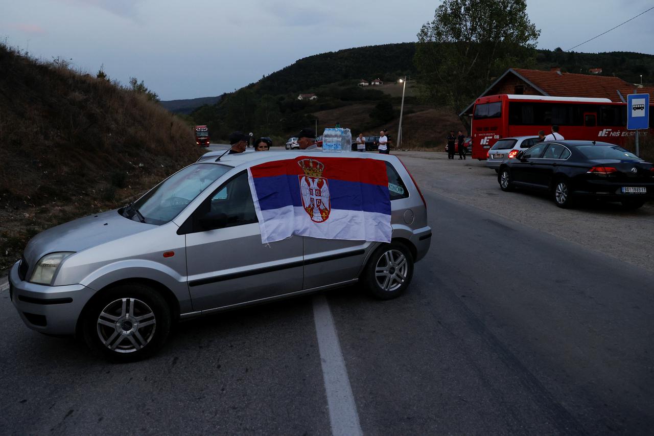 Protestors gather to partially block the road near the main Kosovo-Serbia border crossing in Merdare