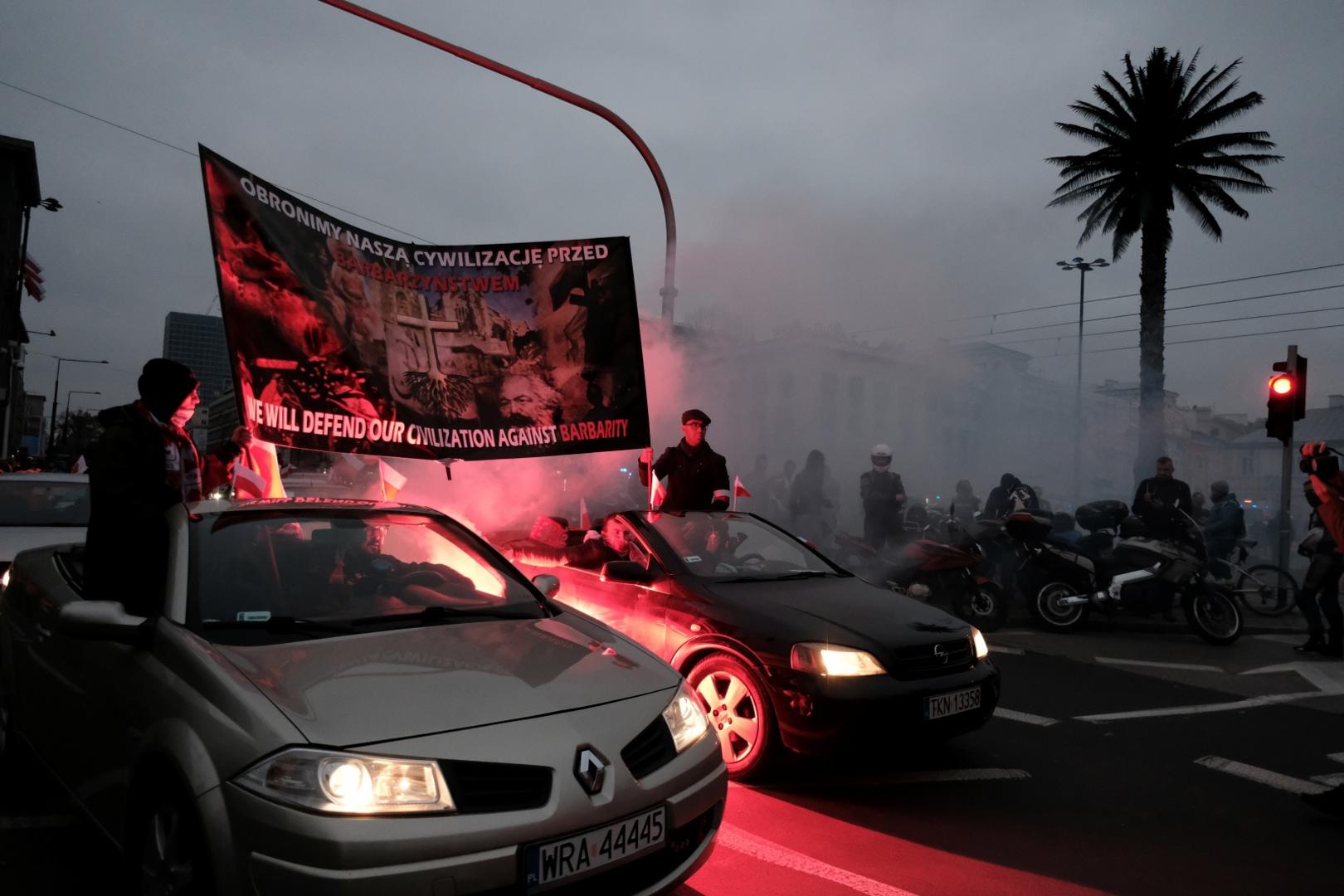 People mark the National Independence Day in Warsaw Demonstrators hold a banner while riding in cars during a march marking the National Independence Day in Warsaw, Poland November 11, 2020. Slawomir Kaminski/Agencja Gazeta/via REUTERS   ATTENTION EDITORS - THIS IMAGE WAS PROVIDED BY A THIRD PARTY. POLAND OUT. NO COMMERCIAL OR EDITORIAL SALES IN POLAND. SLAWOMIR KAMINSKI