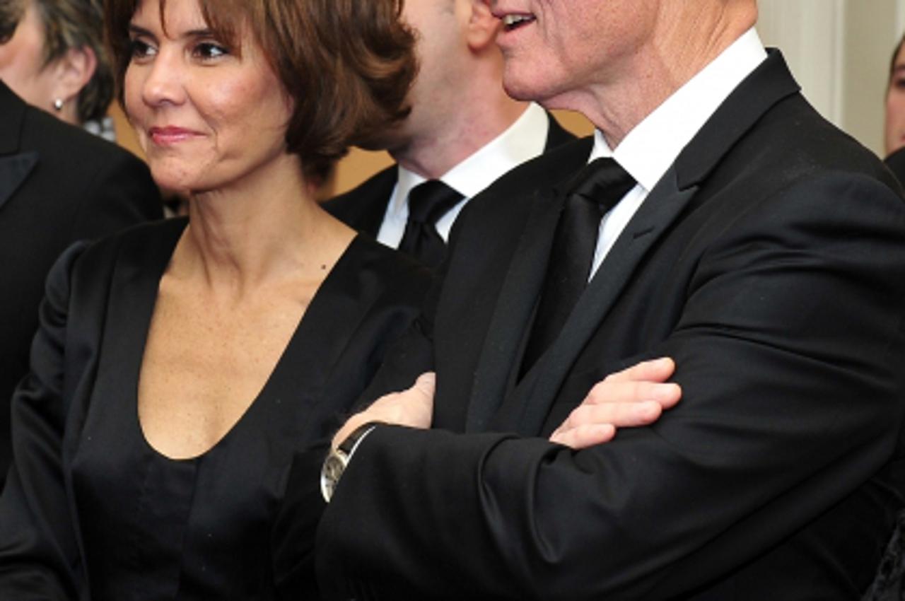 'Former United States President Bill Clinton, right, speaks with Capricia Penavic Marshall, Chief of Protocol of the United States, left, as he watches the recipients of the 2011 Kennedy Center Honors