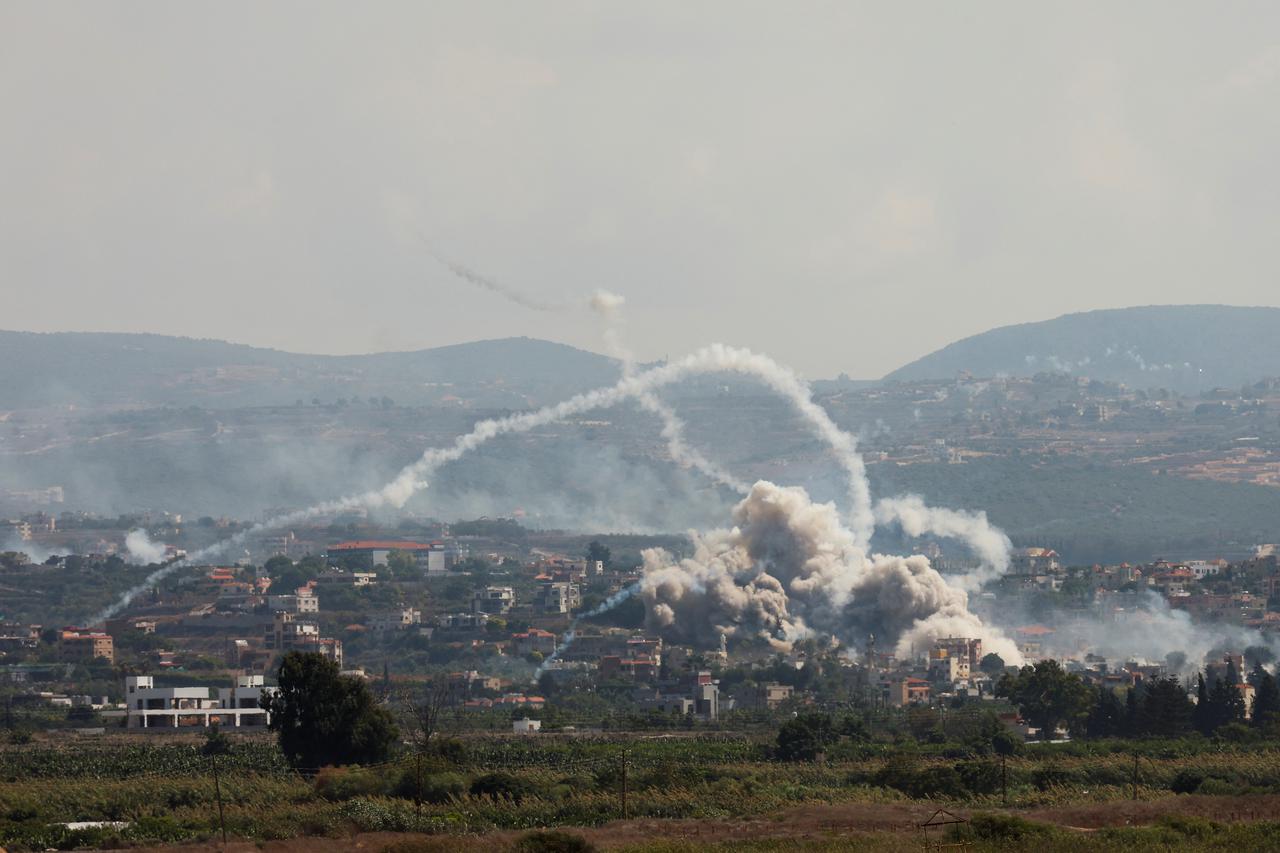 Smoke billows over southern Lebanon following Israeli strikes, as seen from Tyre, southern Lebanon