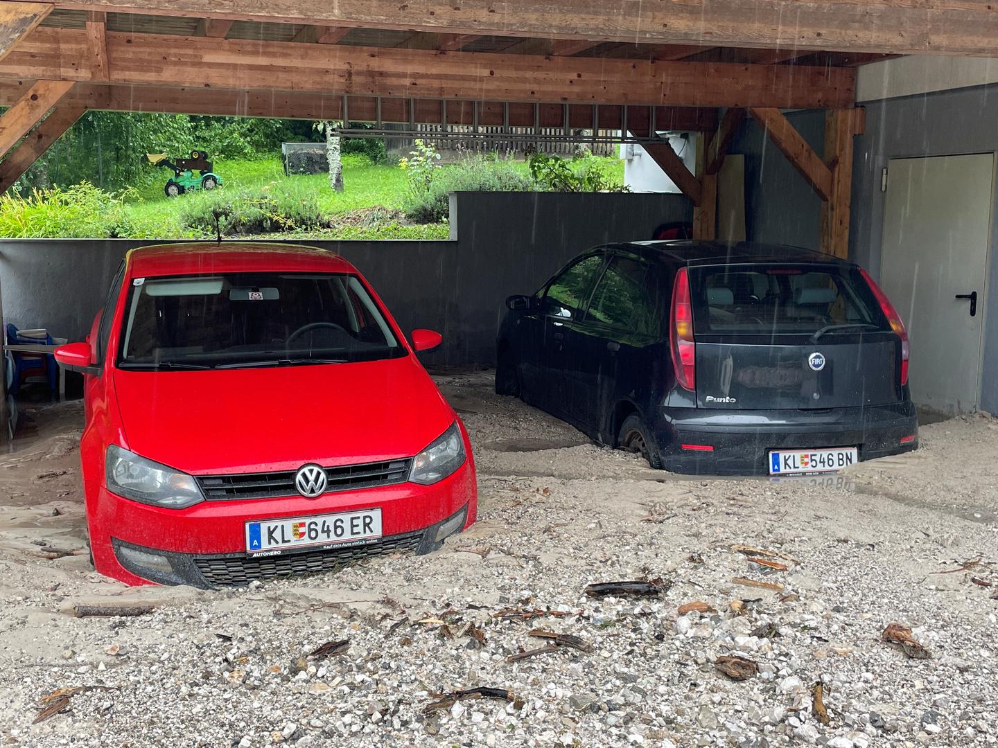 A view of cars parked after a mudslide following heavy rainfall in Unterwaidisch near Ferlach, Austria, August 5, 2023. REUTERS/Louisa Off Photo: LOUISA OFF/REUTERS