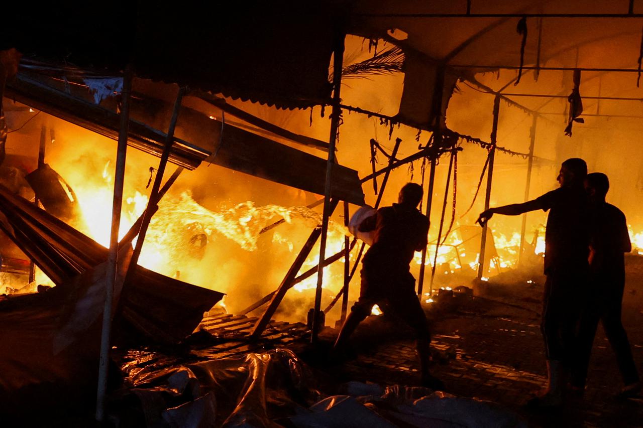 FILE PHOTO: Israeli strike on tents sheltering displaced people, amid the Israel-Hamas conflict, in Deir Al-Balah