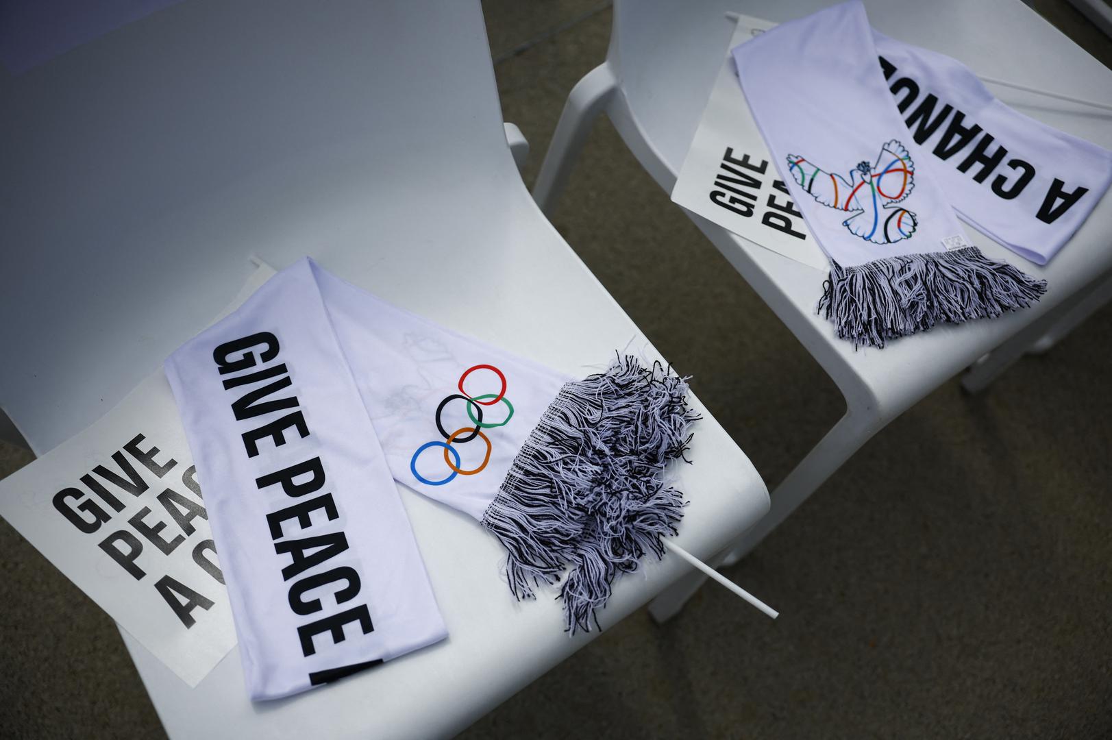 Paris 2024 Olympics - IOC President Thomas Bach at Village Plaza - Olympic Truce Wall inauguration - Olympic Village, Saint Ouen sur Seine, France - July 22, 2024. Olympic Scarfs and flags with a message lay on chairs ahead of the event. REUTERS/Sarah Meyssonnier Photo: Sarah Meyssonnier/REUTERS