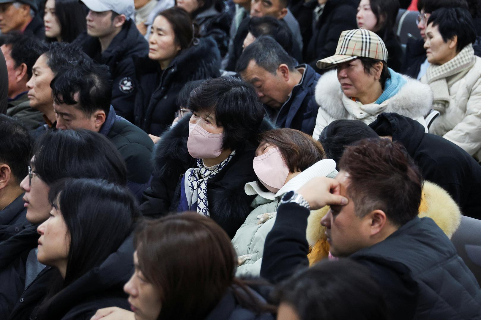 Relatives of passengers of the aircraft that crashed after it went off the runway, gather at Muan International Airport, in Muan, South Korea, December 29, 2024. REUTERS/Kim Hong-Ji Photo: KIM HONG-JI/REUTERS