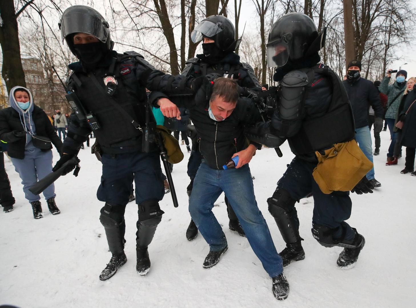 ST PETERSBURG, RUSSIA - JANUARY 31, 2021: Police officers detain a demonstrator during an unauthorised protest in support of the detained opposition activist Alexei Navalny. Navalny, who had been handed a suspended sentence in the Yves Rocher case in 2014, was detained at Sheremetyevo Airport near Moscow on 17 January 2021 for violating probation conditions. A court ruled that Navalny be put into custody until 15 February 2021. Peter Kovalev/TASS Photo via Newscom Newscom/PIXSELL