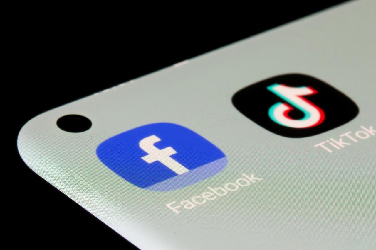 FILE PHOTO: Facebook, TikTok apps are seen on a smartphone in this illustration