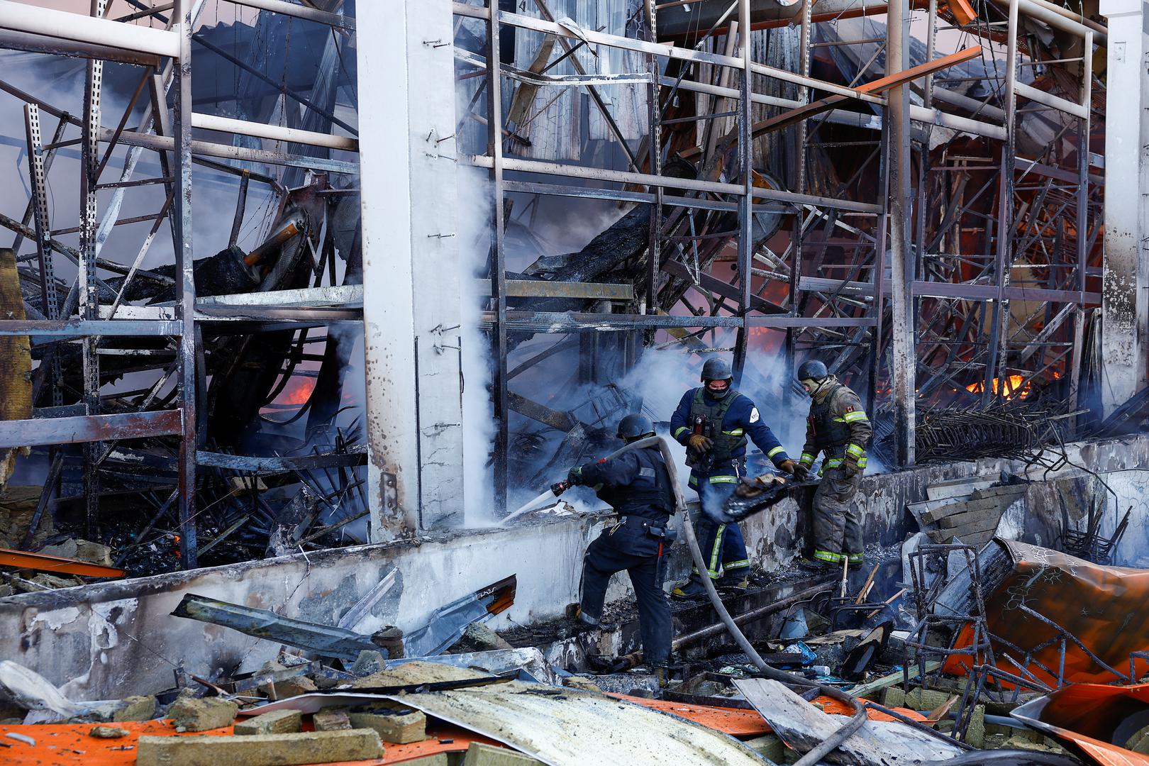 Firefighters work at the site of a household item shopping mall which was hit by a Russian air strike, amid Russia's attack on Ukraine, in Kharkiv, Ukraine, May 25, 2024. REUTERS/Valentyn Ogirenko Photo: VALENTYN OGIRENKO/REUTERS