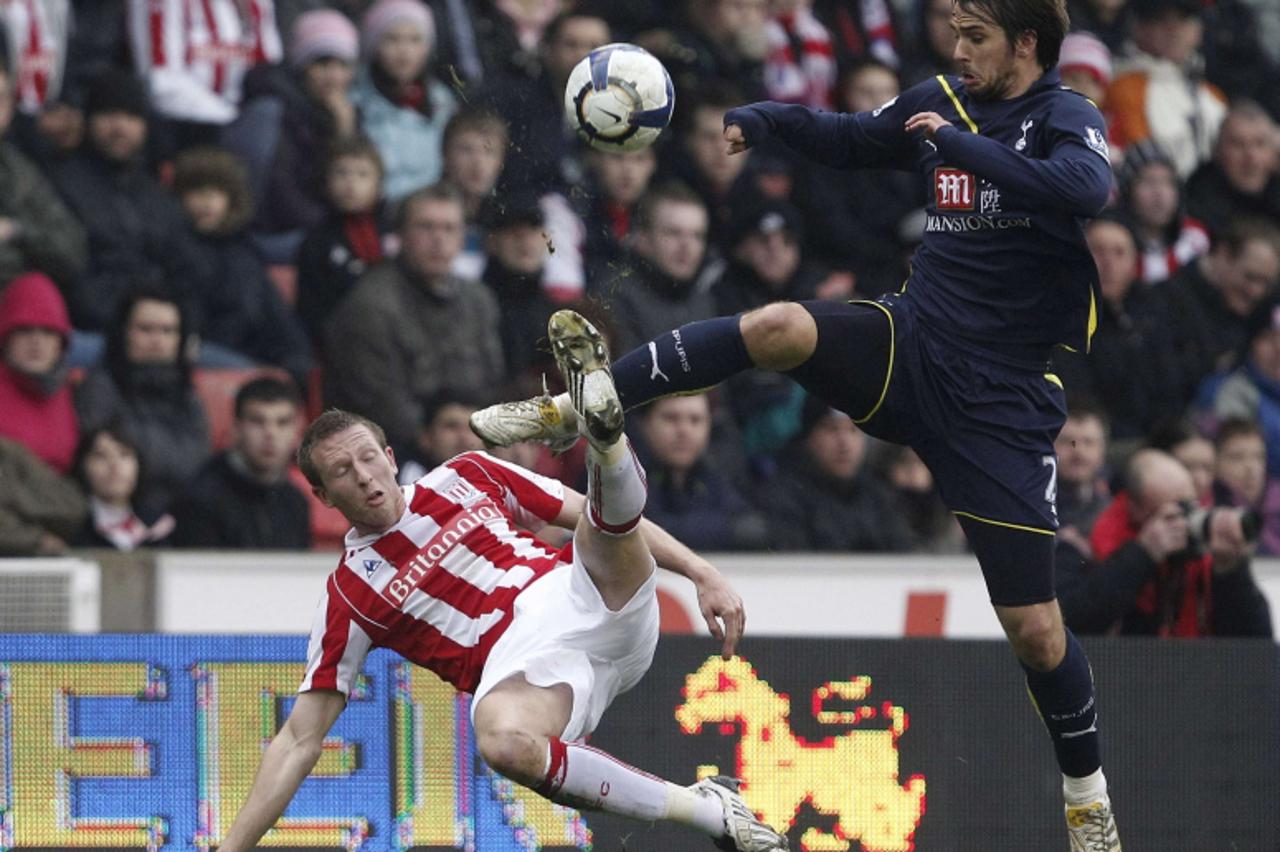 'Stoke City\'s Danny Collins (L) challenges Tottenham Hotspur\'s Niko Kranjcar (R) during their English Premier League soccer match at the Britannia Stadium in Stoke, central England, March 20, 2010. 