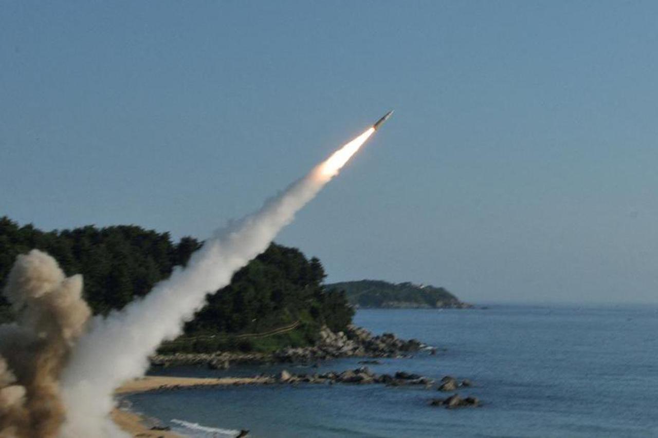 FILE PHOTO: Handout of United States and South Korean troops utilizing the Army Tactical Missile System (ATACMS) and South Korea's Hyunmoo Missile II, fire missiles into the waters of the East Sea, off South Korea