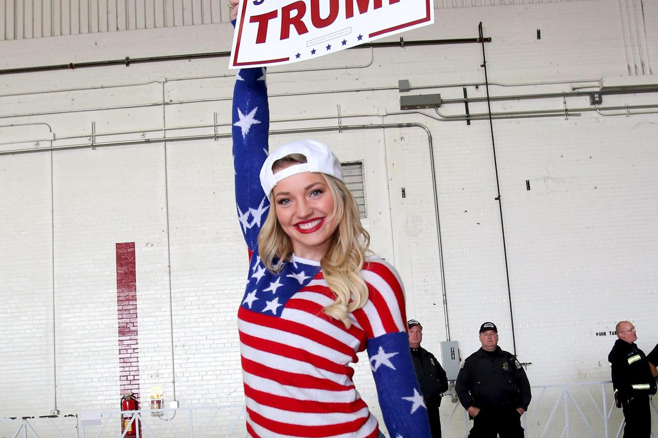 Brianna Dugan holds up her sign in support of Republican U.S. presidential candidate Donald Trump prior to his speaking at a campaign rally on Super Tuesday in Columbus, Ohio March 1, 2016.   REUTERS/Aaron Josefczyk