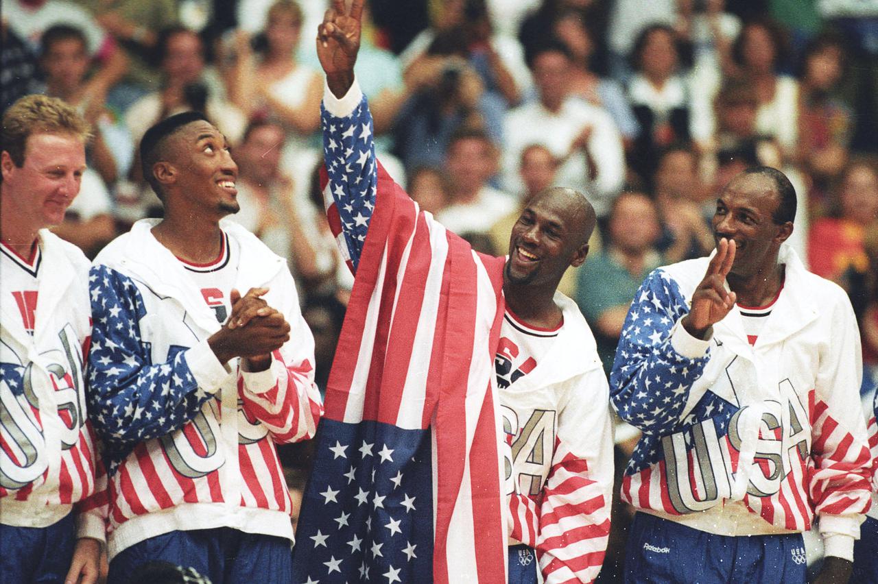 FILE PHOTO: U.S. basketball player Jordan flashes a victory sign as he stands with team mates Larry Bird, Scottie Pippen and Clyde Drexler after winning the Olympic gold in Barcelona