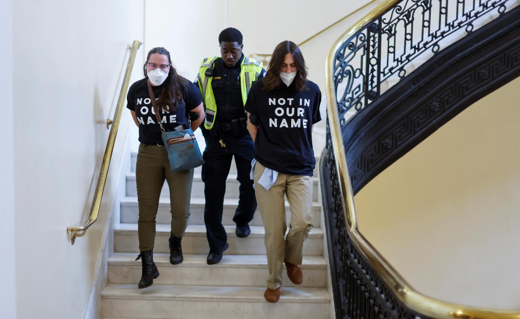 Demonstrators involved in a civil disobedience action organized by a group called "Jewish Voice for Peace" are detained and led out of the building by U.S. Capitol police officers during a protest calling for a cease fire in Gaza occupying parts of the Cannon House office building on Capitol Hill in Washington, U.S., October 18, 2023. REUTERS/Jonathan Ernst Photo: JONATHAN ERNST/REUTERS