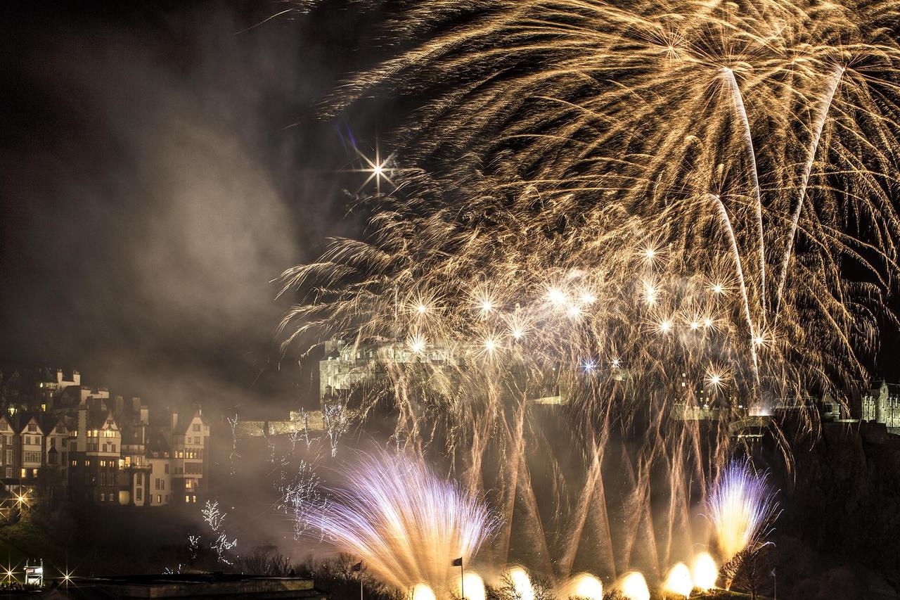 Fireworks are let off at 23:00 as the arrival of 2013 draws closer during Hogmanay in Edinburgh. Scotland's capital is hosting a sell-out Â?30million series of celebrations over several days to celebrate the New Year. 31-12-12 Credit: The Times Online rig