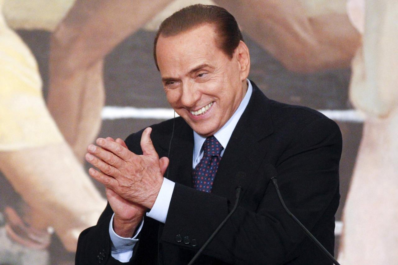 'Italian Prime Minister Silvio Berlusconi smiles during a meeting with Russian President Dmitry Medvedev in downtown Rome February 16, 2011.   REUTERS/Max Rossi   (ITALY - Tags: POLITICS)'