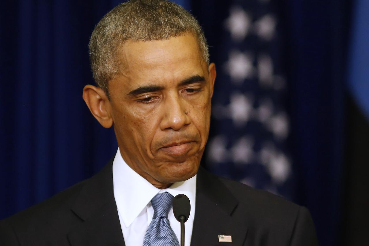 U.S. President Barack Obama pauses during a joint news conference with his Estonian counterpart Toomas Hendrik Ilves, at the Bank of Estonia in Tallinn September 3, 2014.     REUTERS/Larry Downing   (ESTONIA - Tags: POLITICS PROFILE HEADSHOT)