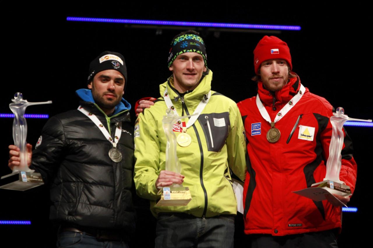 '(L to R) Simon Fourcade of France, Jakov Fak of Slovenia and Jaroslav Soukup of the Czech Republic  pose during a medal ceremony at the Biathlon World Championships in Ruhpolding March 6, 2012. Fak w