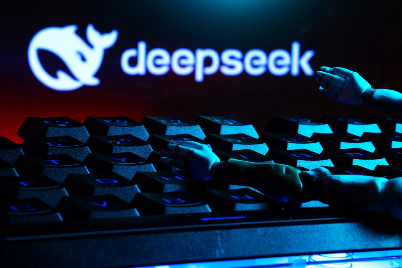 Illustration shows deepseek logo, keyboard, and robot hands