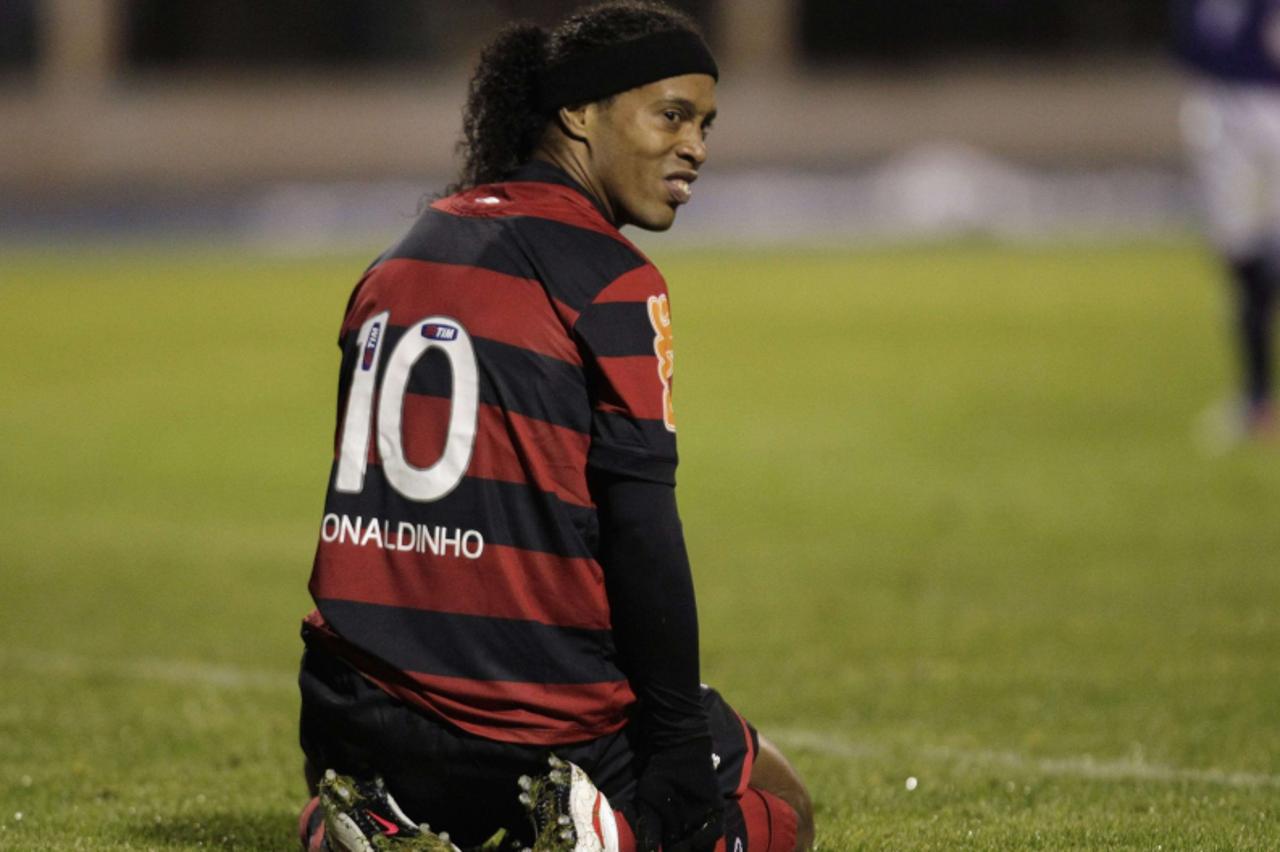 'Ronaldinho of Brazil\'s Flamengo reacts to a play against Bolivia\'s Real Potosi during their Copa Libertadores soccer match in Potosi January 25, 2012.          REUTERS/David Mercado (BOLIVIA - Tags