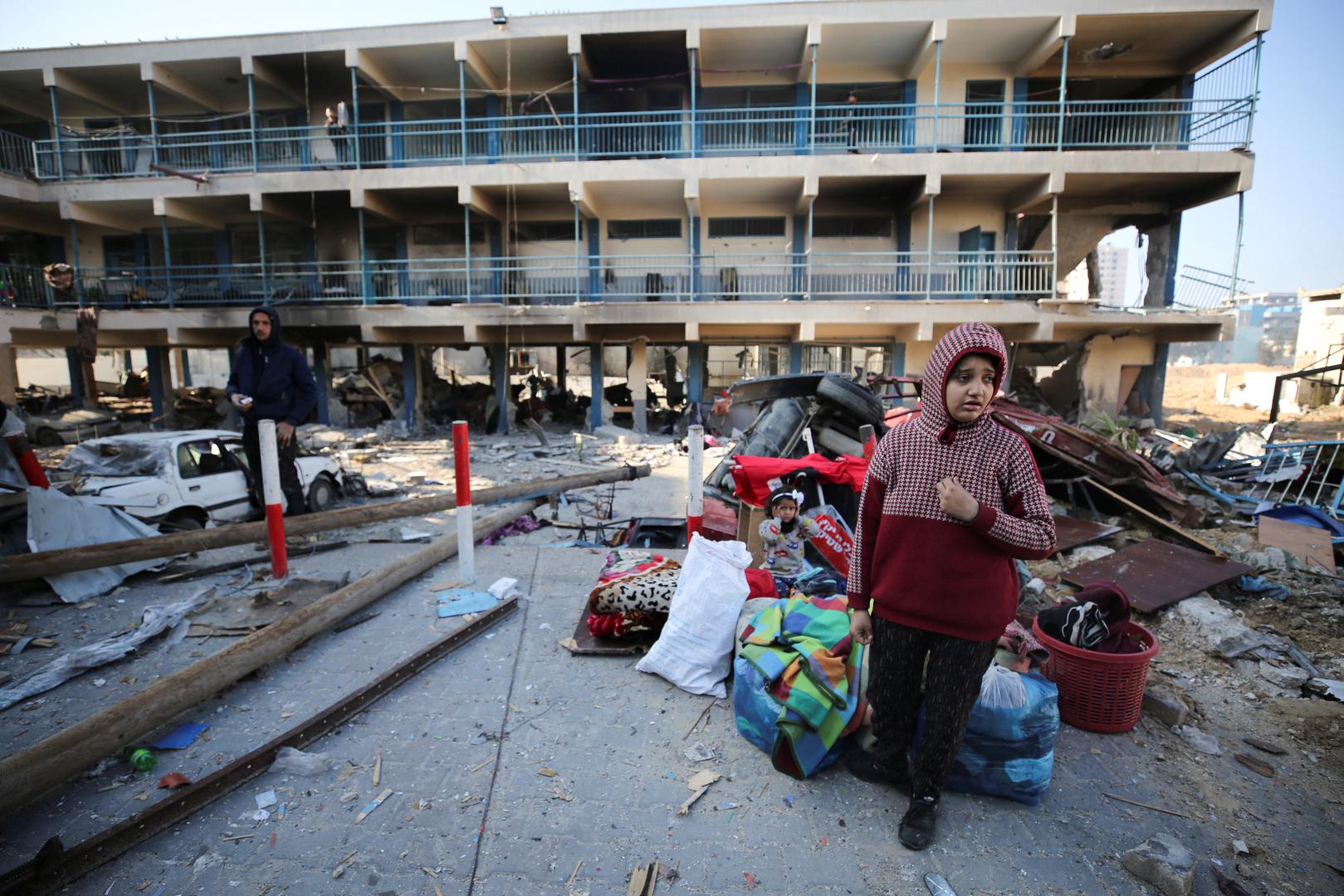 Palestinians walk at the damaged UNRWA school, following an Israeli ground operation, amid the ongoing conflict between Israel and Hamas, in Gaza City, February 10, 2024. REUTERS/Stringer Photo: STRINGER/REUTERS