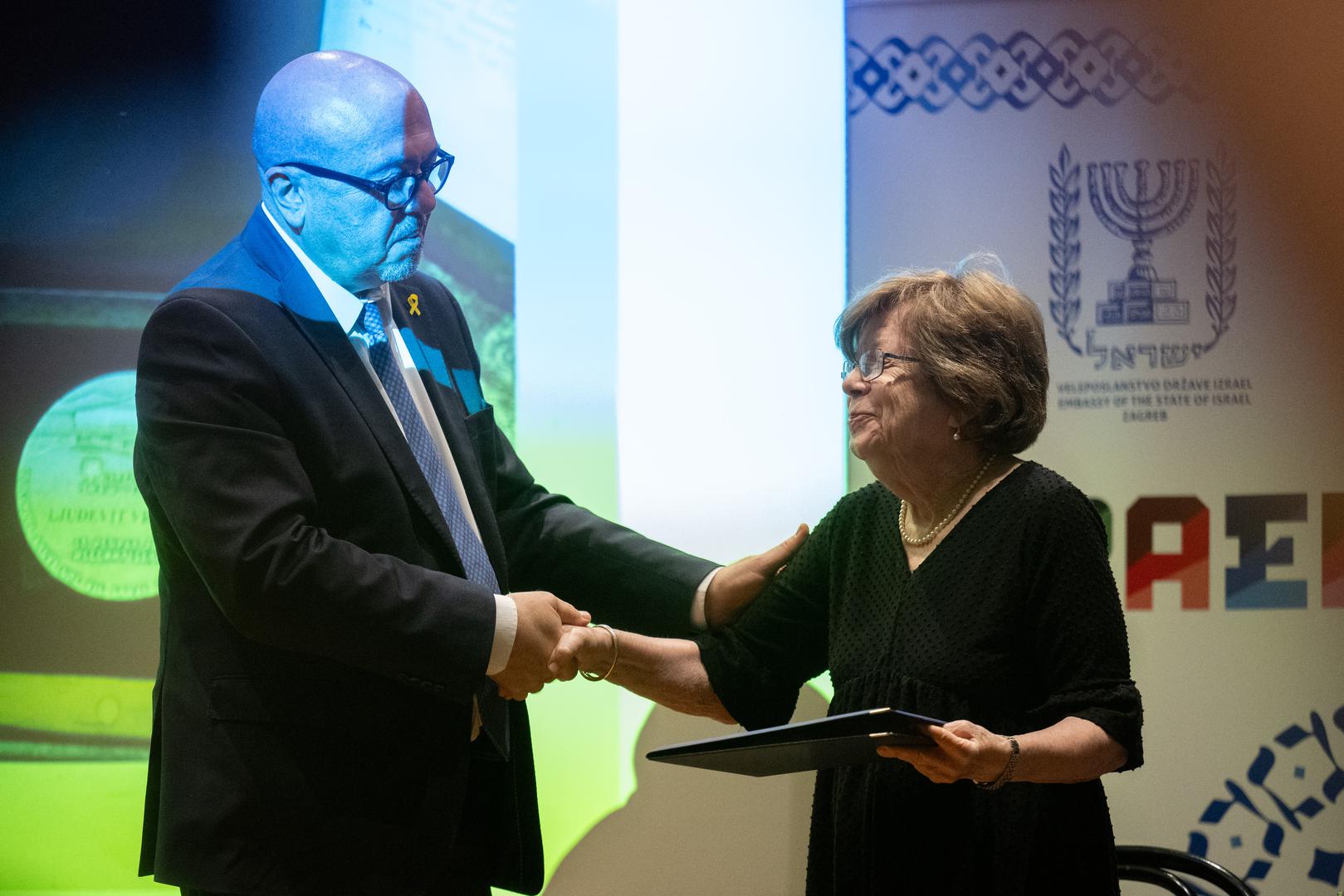 03.09.2024., Zagreb - U Zidovskoj opcini Zagreb odrzana je ceremonija predaje odlikovanja i titule Pravednika medju narodima koju dodjeljuje Jad Vasem - Svjetski centar za sjecanje na Holokaust, pokojnom Ljudevitu Vrancicu koji je spasio Theodoru Basch Klayman tijekom Holokausta, a kasnije ju je usvojio kao vlastitu kcer. Odlikovanje je preuzela Theodora Basch Klayman. Gary Koren, Theodora Basch Klayman.
 Photo: Davor Puklavec/PIXSELL