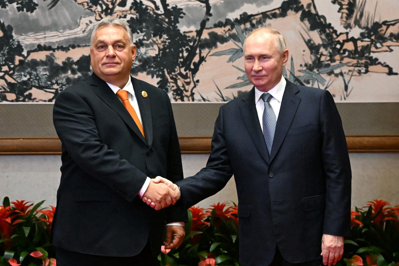 FILE PHOTO: Russian President Putin and Hungarian Prime Minister Orban meet in Beijing