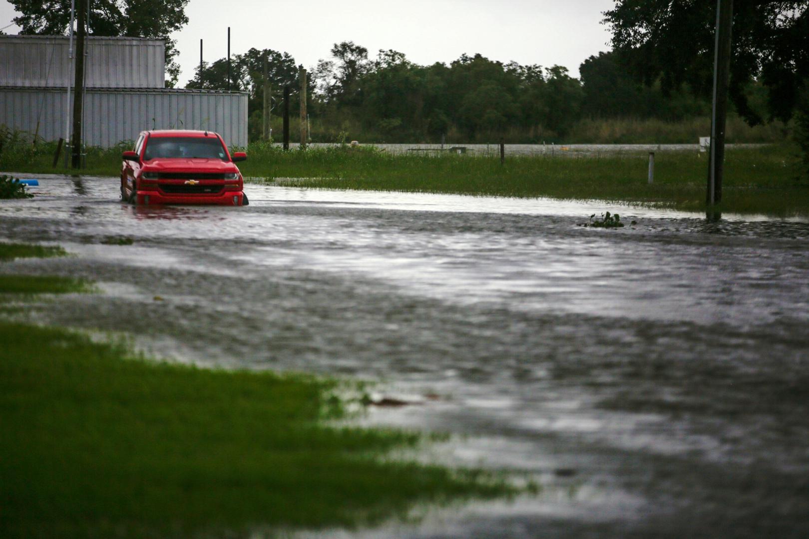 Hurricane Laura threatens Gulf Coast, forcing mass evacuations A car near Vermilion Bay is seen partially submerged in waters brought by Hurricane Laura approaching Abbeville, Louisiana, U.S., August 26, 2020.  REUTERS/Kathleen Flynn REFILE - CORRECTING INFORMATION KATHLEEN FLYNN