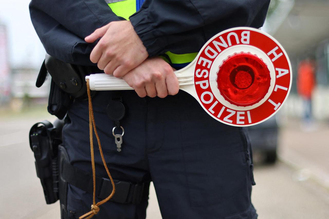 German police officers conduct random checks at a border with France, in Kehl