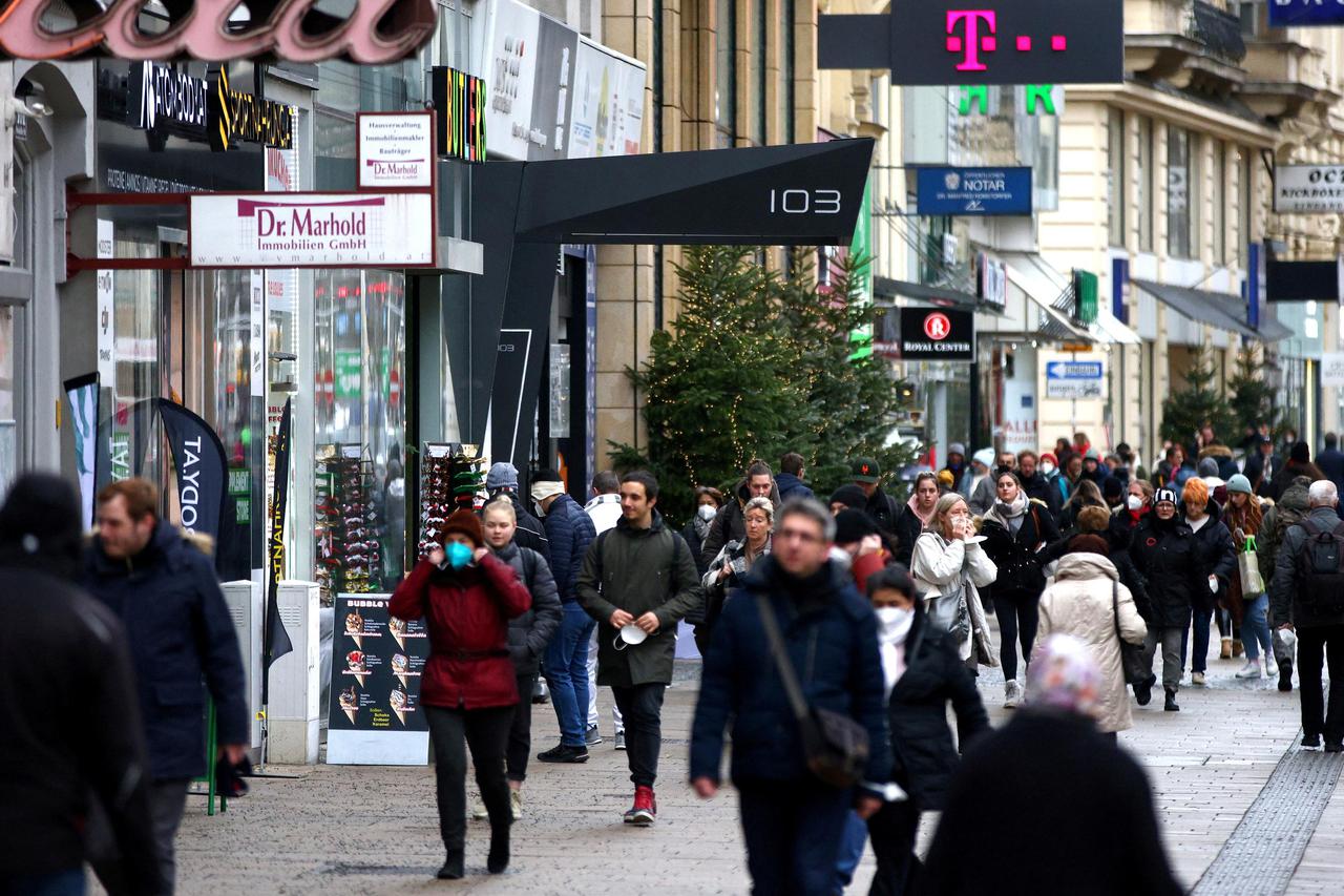 FILE PHOTO: People walk along a shopping street after the fourth full national coronavirus disease (COVID-19) lockdown was lifted, in Vienna, Austria, December 13