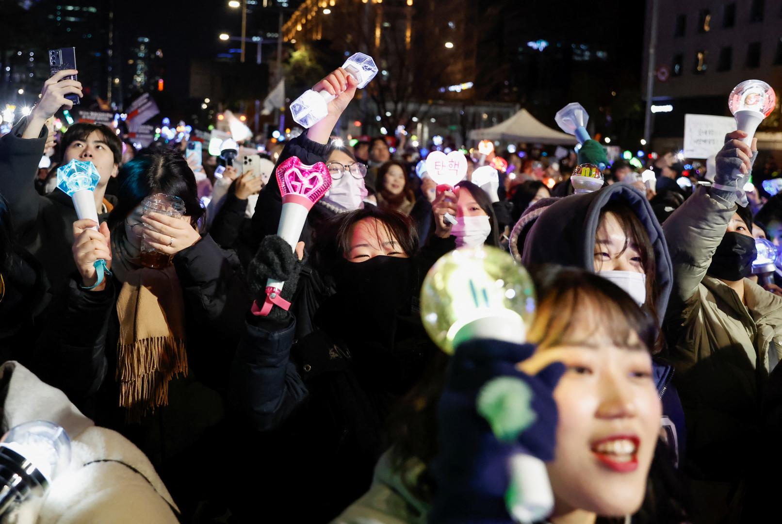 People carry K-pop idol sticks, as protesters take part in a rally calling for the impeachment of South Korean President Yoon Suk Yeol, who declared martial law, which was reversed hours later, near the National Assembly in Seoul, South Korea, December 8, 2024. REUTERS/Kim Soo-hyeon Photo: KIM SOO-HYEON/REUTERS