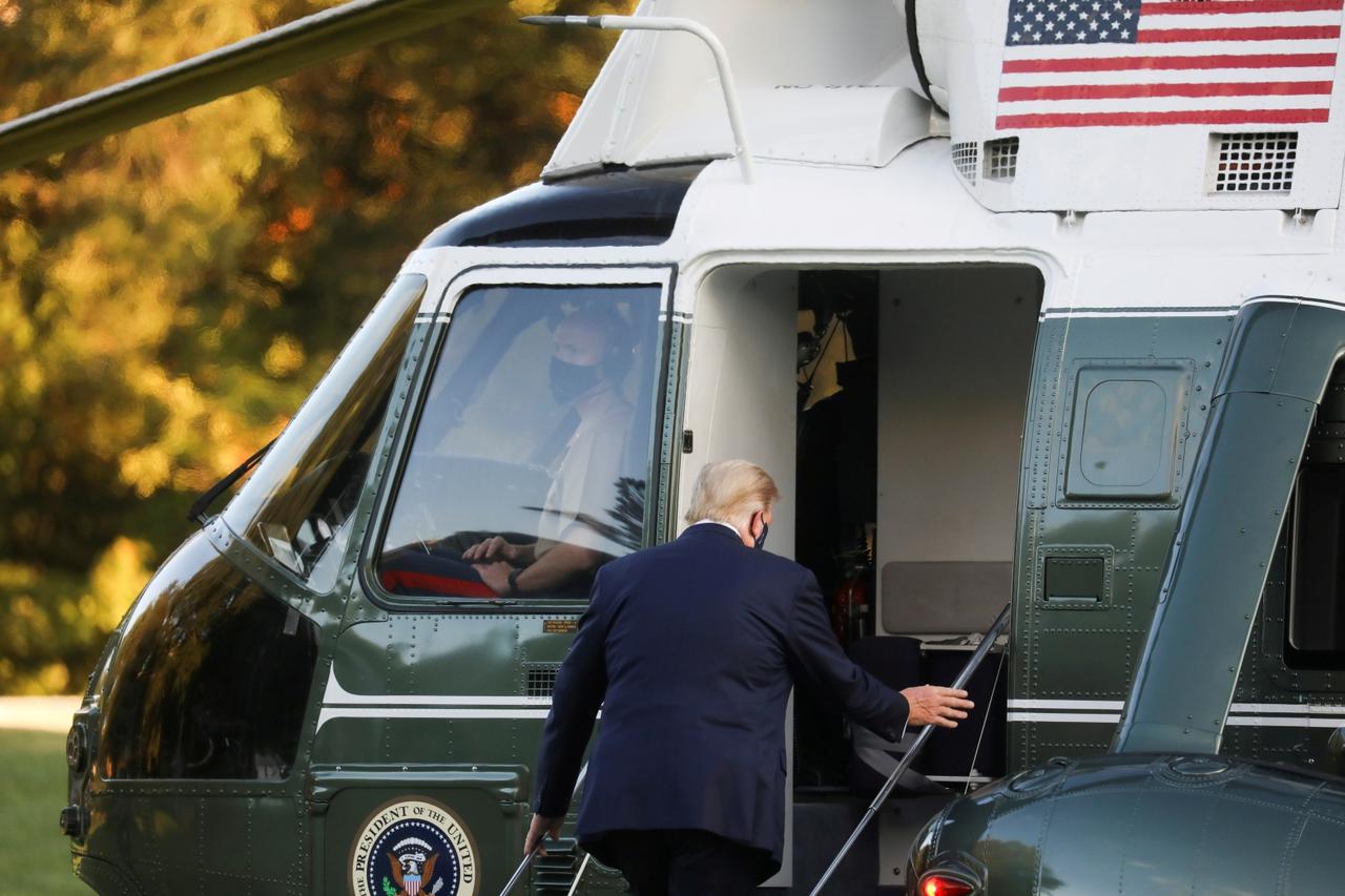 FILE PHOTO: U.S. President Trump boards the Marine One helicopter as he departs for Walter Reed Medical Center from the White House in Washington