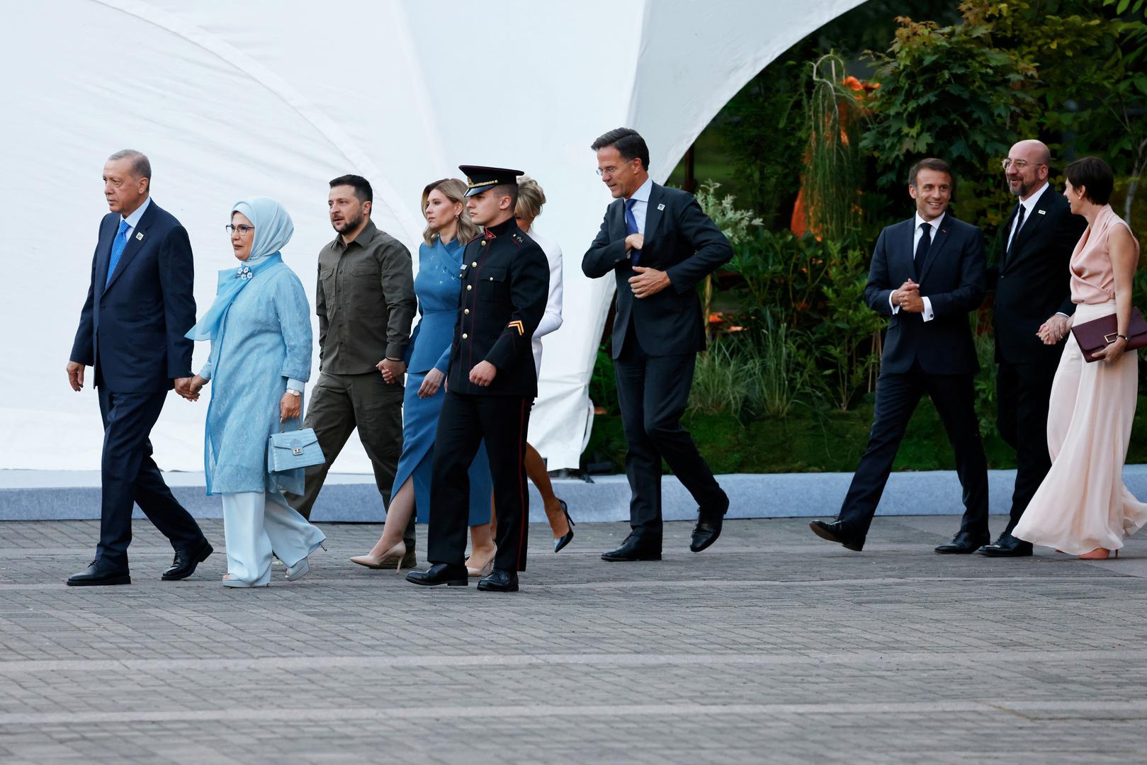 Turkey's President Tayyip Erdogan, Turkish President's wife Emine Erdogan, Ukraine's President Volodymyr Zelensky, his wife Olena Zelenska, Netherlands' Prime Minister Mark Rutte, France's President Emmanuel Macron, European Council President Charles Michel and his partner Amelie Derbaudrenghien walk ahead of the social dinner during the NATO summit, at the Presidential Palace in Vilnius, Lithuania on July 11, 2023. LUDOVIC MARIN/Pool via REUTERS Photo: POOL/REUTERS