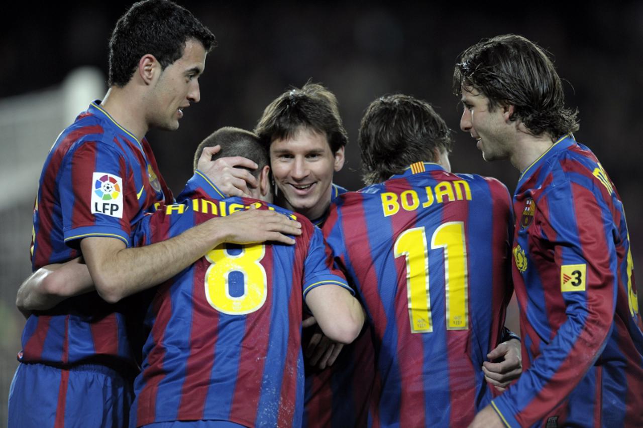 '(L to R) Barcelona\'s midfielder Sergio Busquets, midfielder Andres Iniesta, Argentinian forward Lionel Messi, forward Bojan Krkic and Brazilian defender Maxwell celebrate after scoring against Racin