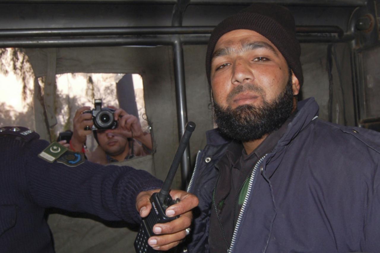 'Mumtaz Qadri, a bodyguard of Punjab governor Salman Taseer, is photographed after being detained at the site of Taseer\'s shooting in Islamabad in this January 4, 2011 file photo. A Pakistani court s