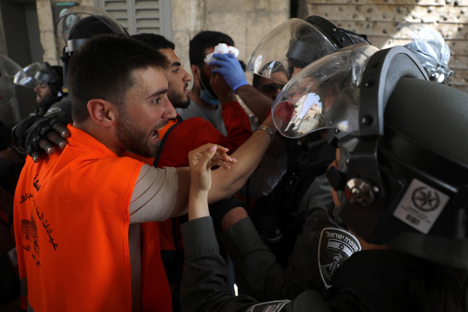 Israeli police clash with Palestinians at the compound that houses Al-Aqsa Mosque in Jerusalem A Palestinian medic argues with Israeli police during clashes at the compound that houses Al-Aqsa Mosque, known to Muslims as Noble Sanctuary and to Jews as Temple Mount, in Jerusalem's Old City, May 10, 2021. REUTERS/Ammar Awad AMMAR AWAD