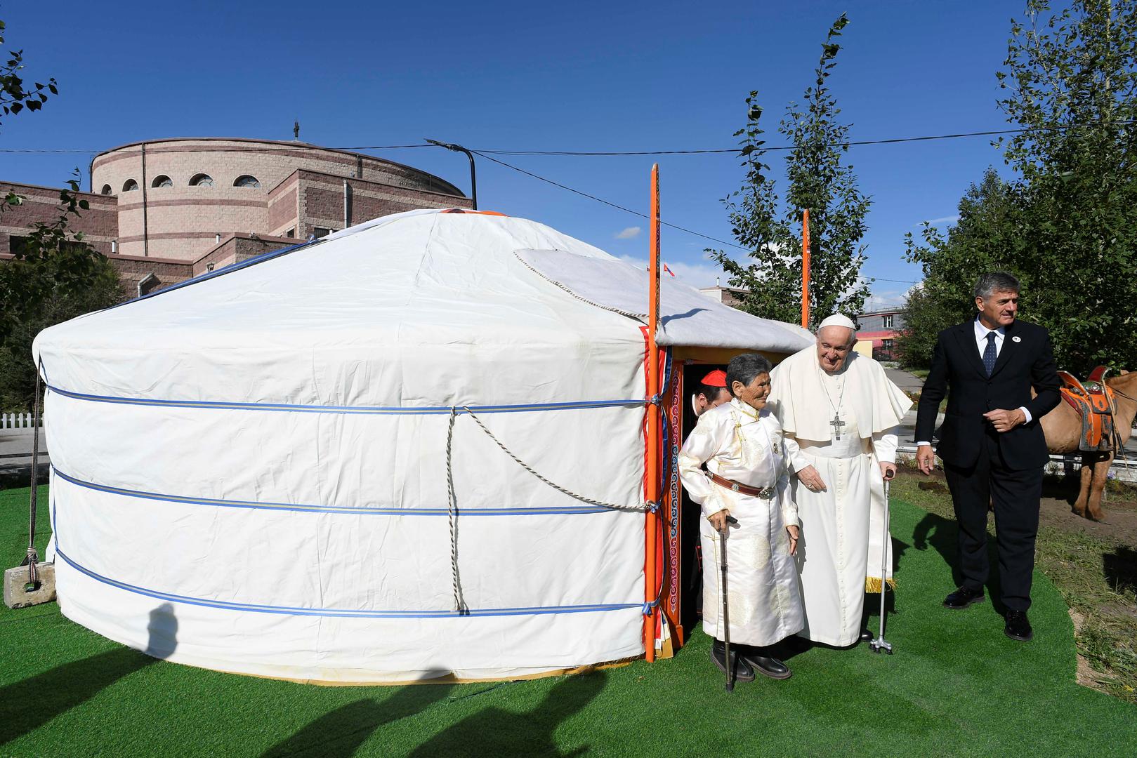 Pope Francis walks with Madame Tsetsege on the day he meets with bishops, priests, missionaries, consecrated persons and pastoral workers at Saints Peter and Paul Cathedral, during his Apostolic Journey in Ulaanbaatar, Mongolia September 2, 2023.  Vatican Media/­Handout via REUTERS    ATTENTION EDITORS - THIS IMAGE WAS PROVIDED BY A THIRD PARTY. Photo: VATICAN MEDIA/REUTERS