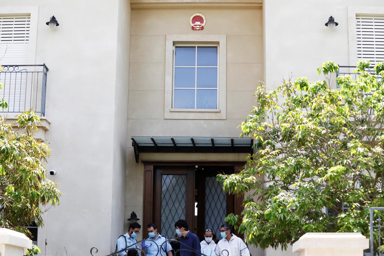 Israeli police and forensic experts are seen at the door of China's ambassador to Israel, Du Wei's home in Herzliya, near Tel Aviv, Israel Israeli police and forensic experts are seen at the door of China's ambassador to Israel, Du Wei's home in Herzliya, near Tel Aviv, Israel May 17, 2020. REUTERS/Nir Elias NIR ELIAS