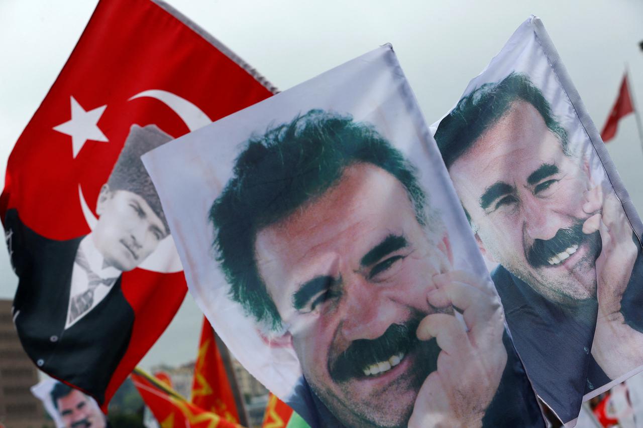 FILE PHOTO: Flags with a picture of the jailed Kurdish militant leader Ocalan and of modern Turkey's founder Ataturk are pictured during a gathering of supporters of the Pro-Kurdish Peoples' Democratic Party in Istanbul