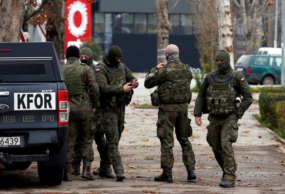 Polish KFOR soldiers patrol in North Mitrovica