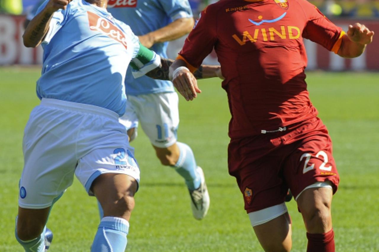 'AS Roma Marco Borriello (R) fights for the ball with SSC Napoli Paolo Cannavaro (L) during their Serie A football match SSC Napoli vs AS Roma at San Paolo Stadium in Naples on October 3, 2010. AFP PH