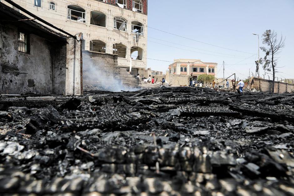 Smoke rises from the wreckage of Saudi-led air strikes, in Sanaa