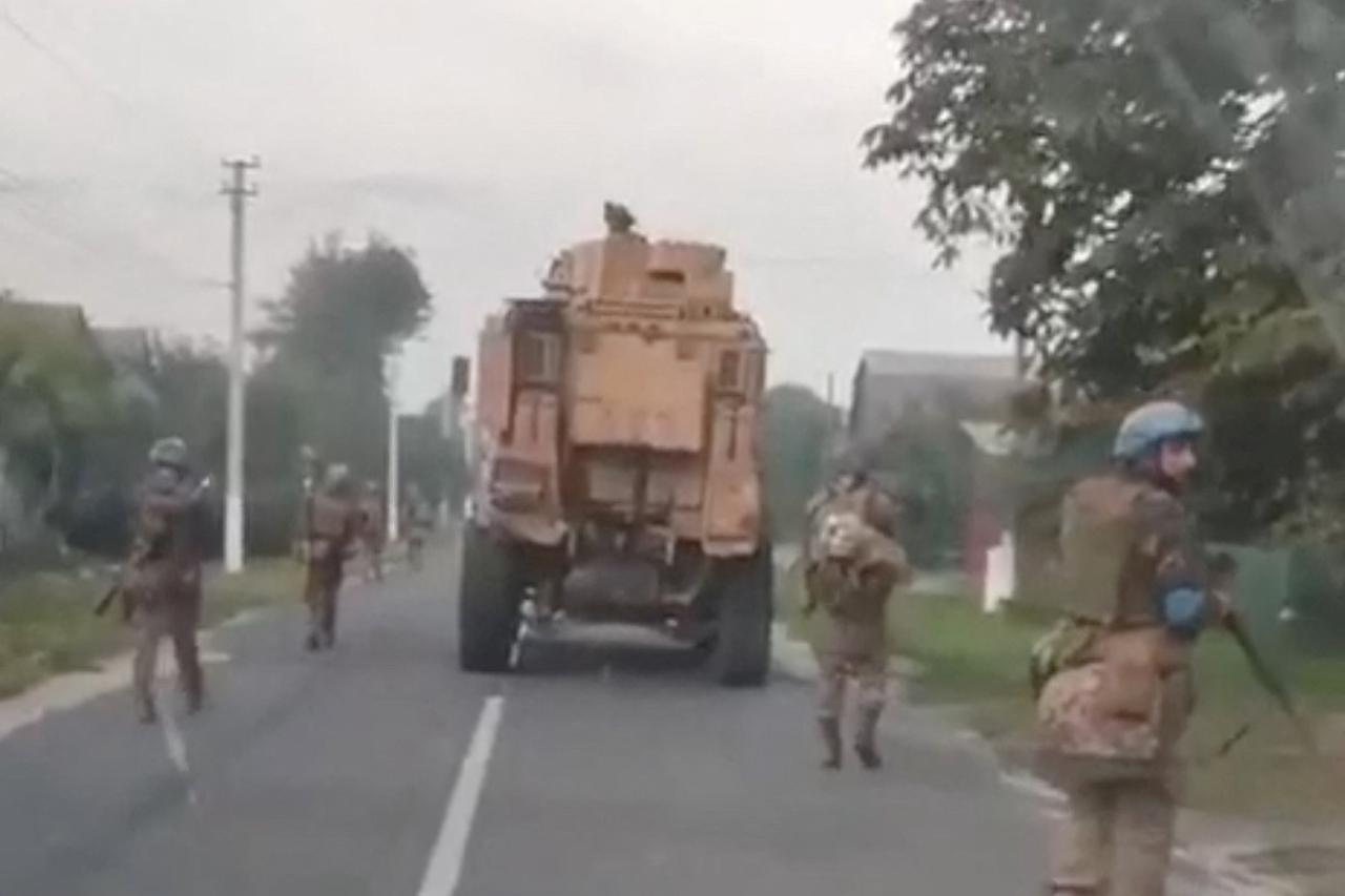 Members of the Ukrainian army patrol in Plekhovo