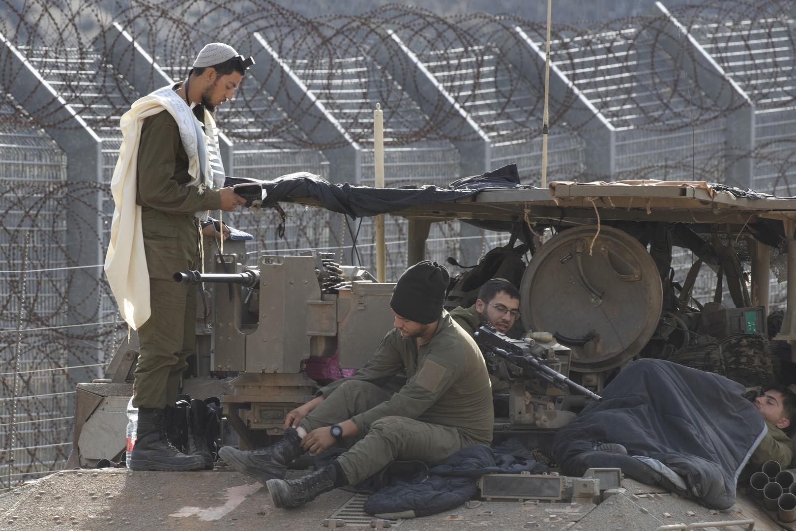 An Israeli soldier performs hi morning prayers atop an Armoured Personnel Carrier (AC) along the border with Syria inside northern Israel in the Israeli-controlled Golan Heights on December 10, 2024. Israel is extending is presence on the ground inside Syria following the Syrian rebel takeover of most of the country in the past days. Photo by Jim Hollander/UPI Photo via Newscom Photo: JIM HOLLANDER/NEWSCOM