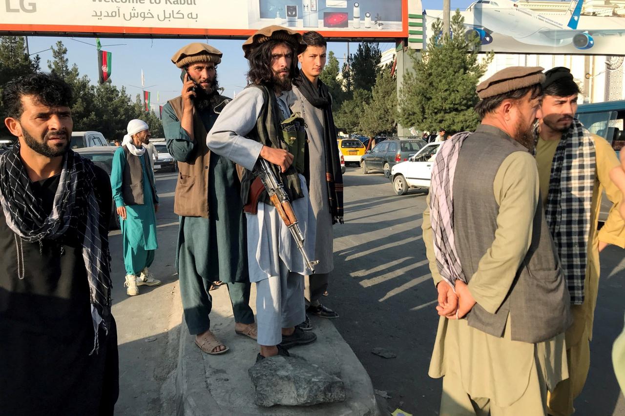 A member of Taliban stands outside Hamid Karzai International Airport in Kabul