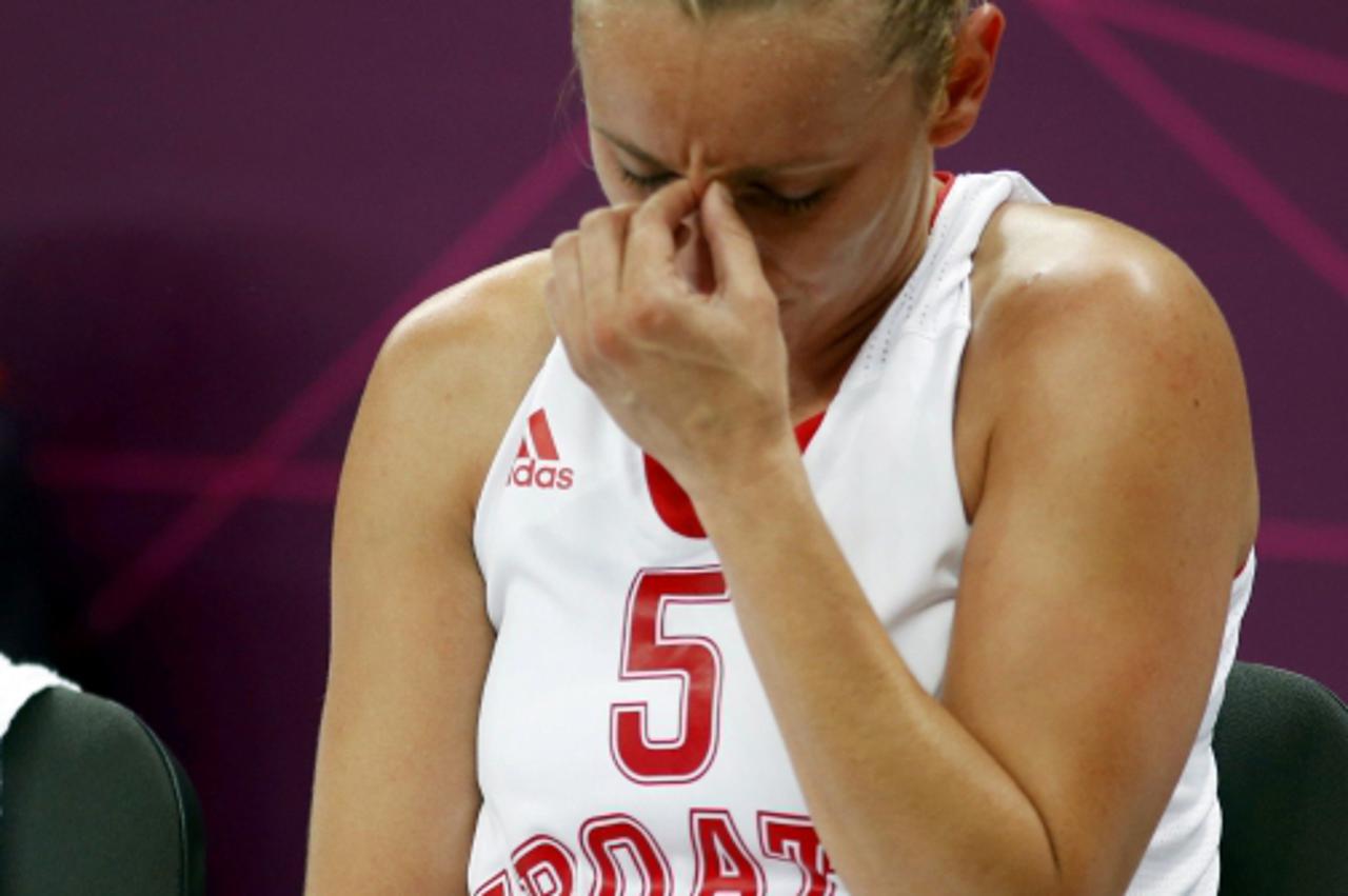 'Croatia\'s Andja Jelavic reacts after their defeat to China during the women\'s preliminary round Group A basketball match at the Basketball Arena during the London 2012 Olympic Games July 30, 2012. 