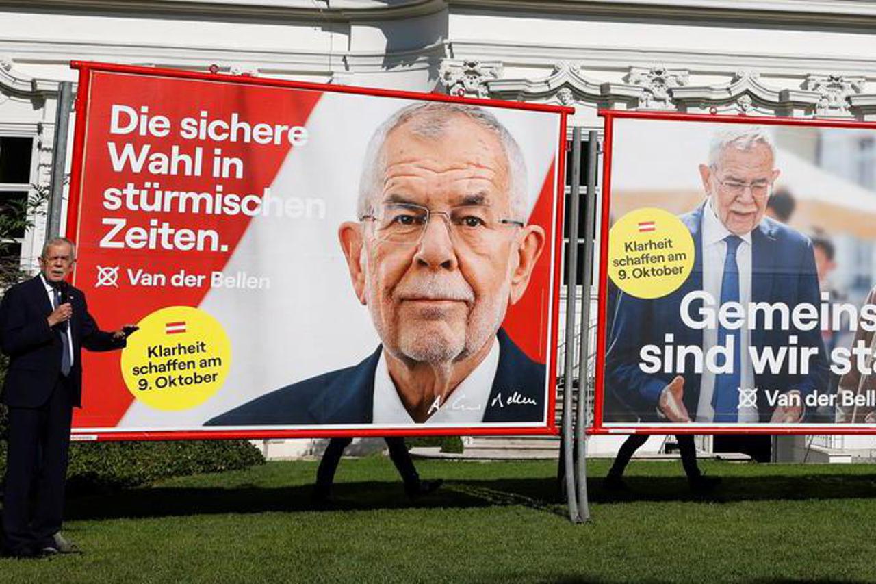 Austrian President Van der Bellen presents election campaign posters in Vienna