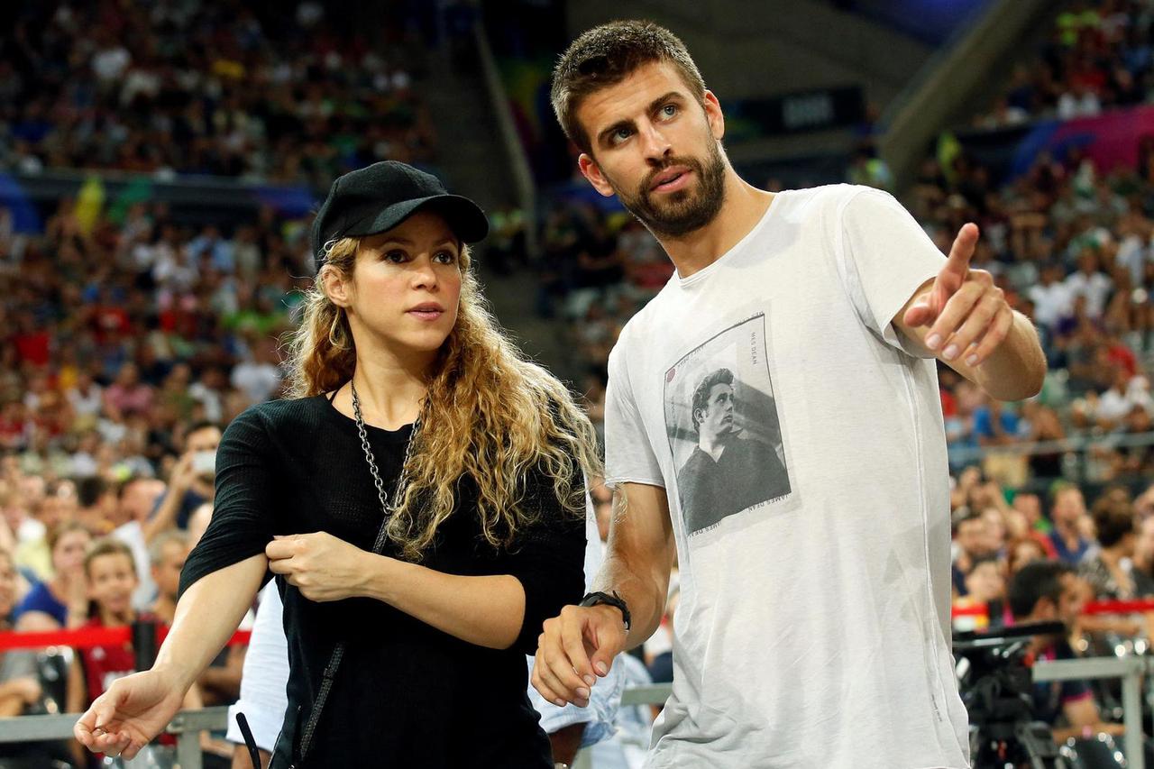 FILE PHOTO: Colombian singer Shakira and her partner, Barcelona soccer player Pique, attend the Basketball World Cup quarter-final game between the U.S. and Slovenia in Barcelona