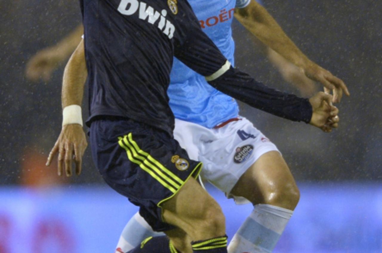 'Real Madrid's Croatian midfielder Luka Modric (L) vies with Celta's midfielder Borja Oubina during the Spanish Copa del Rey (King's Cup) football match RC Celta de Vigo vs Real Madrid CF at the Ba