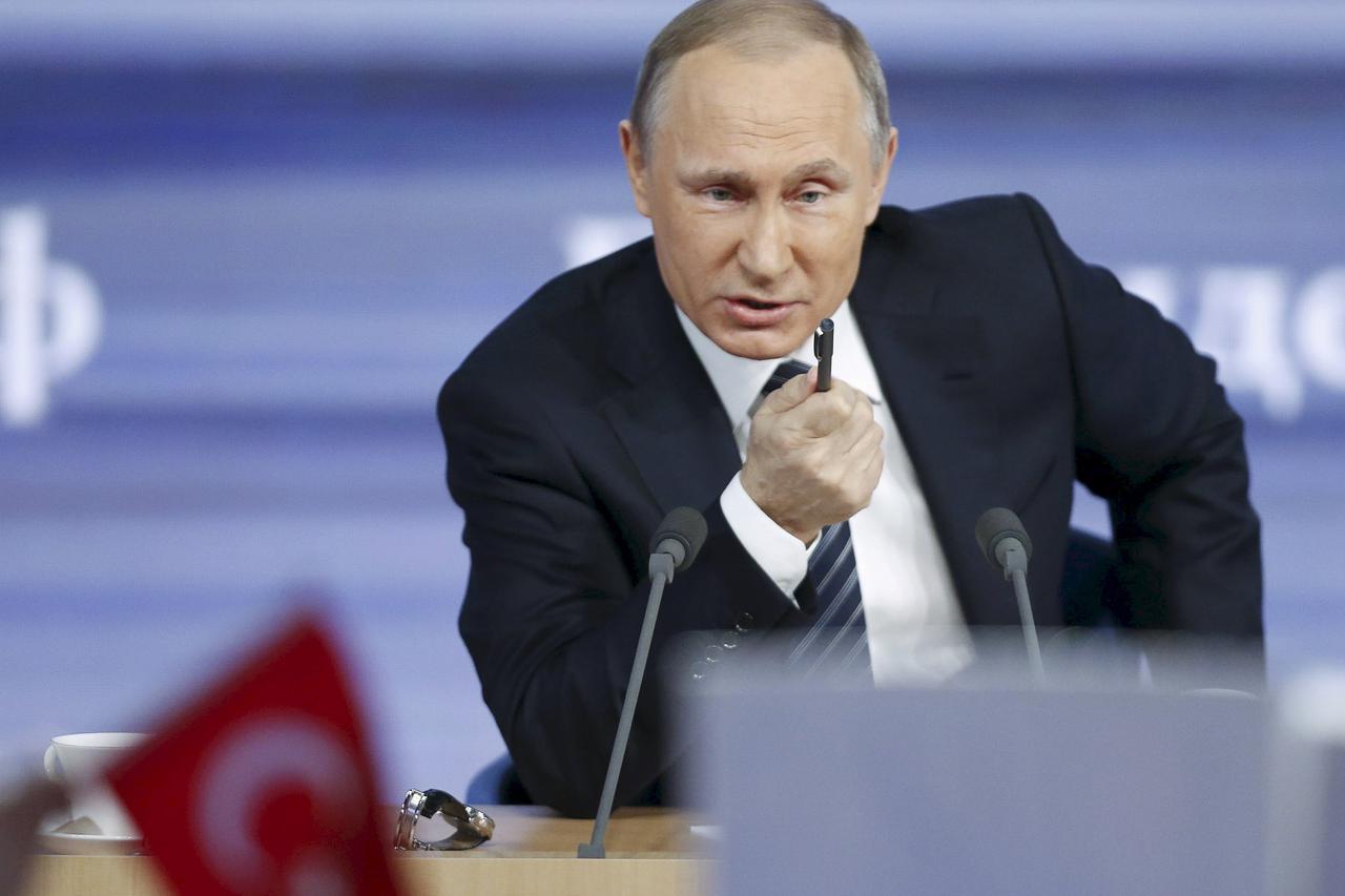 Russian President Vladimir Putin speaks during his annual end-of-year news conference, with a flag of Turkey seen in the foreground, in Moscow, Russia, in this December 17, 2015 file photo. REUTERS/Maxim Zmeyev/Files